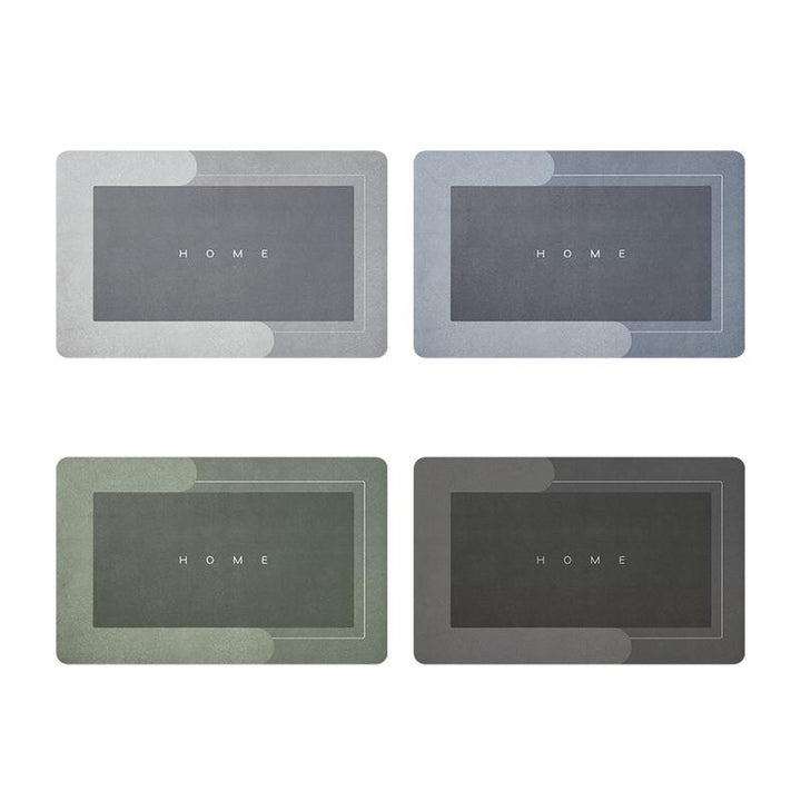Vier rechteckige Fußmatten in Grau und Grün mit "HOME"-Aufschrift, rutschfest, modern.