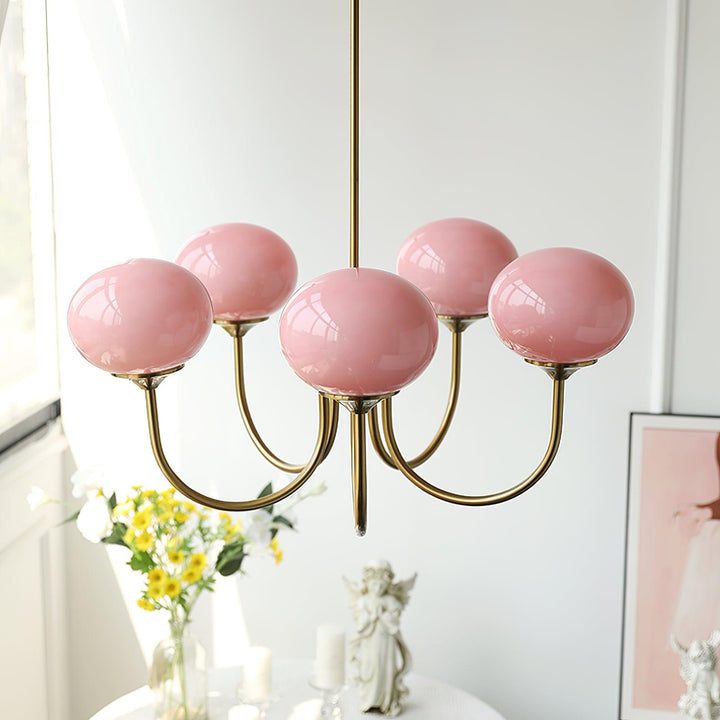 Rosa Kronleuchter mit Kugelglas, modernes Design, Wohnzimmerbeleuchtung, goldene Halterung.