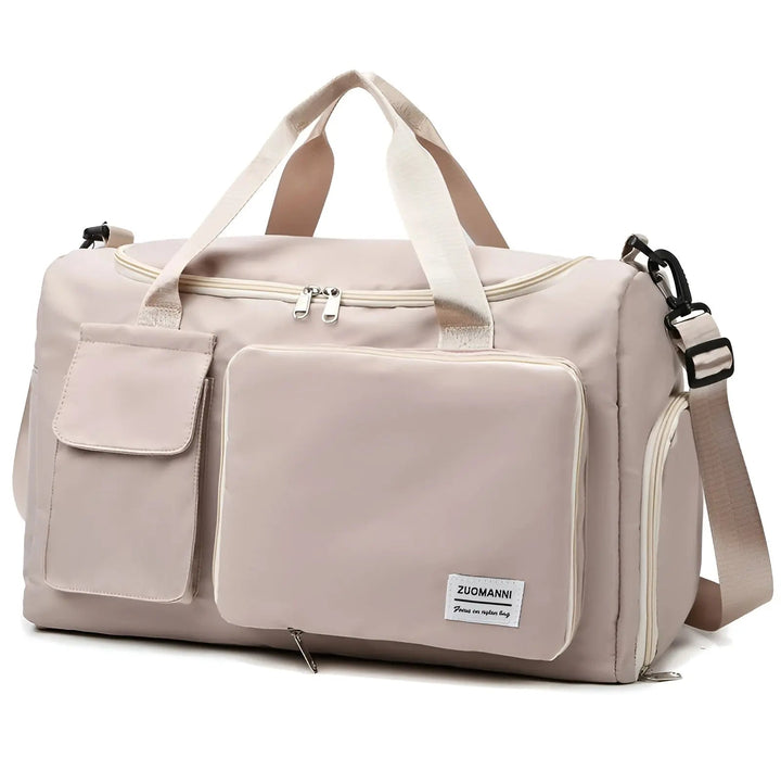 Beige Reisetasche mit Schultergurt, Reißverschlusstaschen, ideal für Reisen und Sport.
