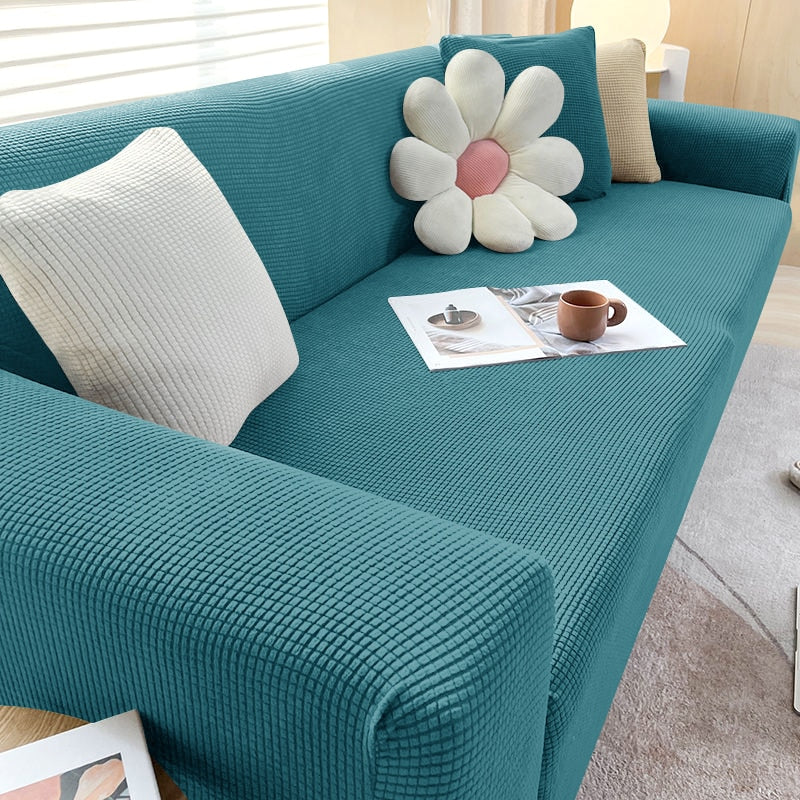 Tealblaues Sofa mit Kissen, Blumenform, Wohnzimmer, modernes Design, gemütlich, stilvoll.