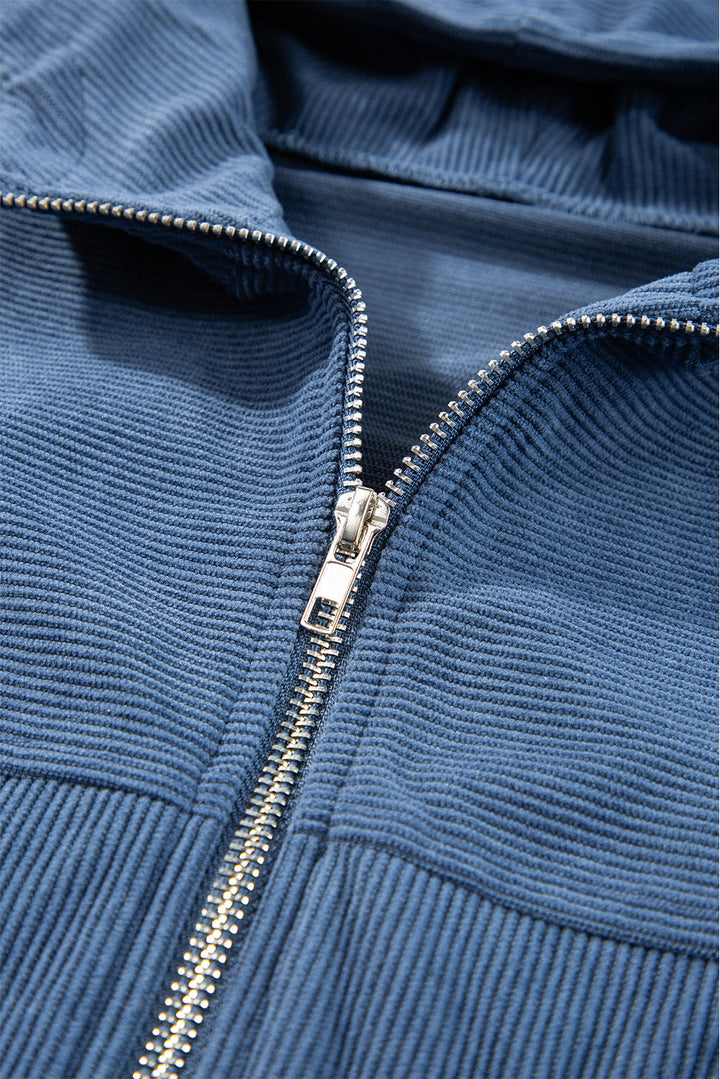 Blaugrüne Cordjacke mit Kapuze und Kordelzug