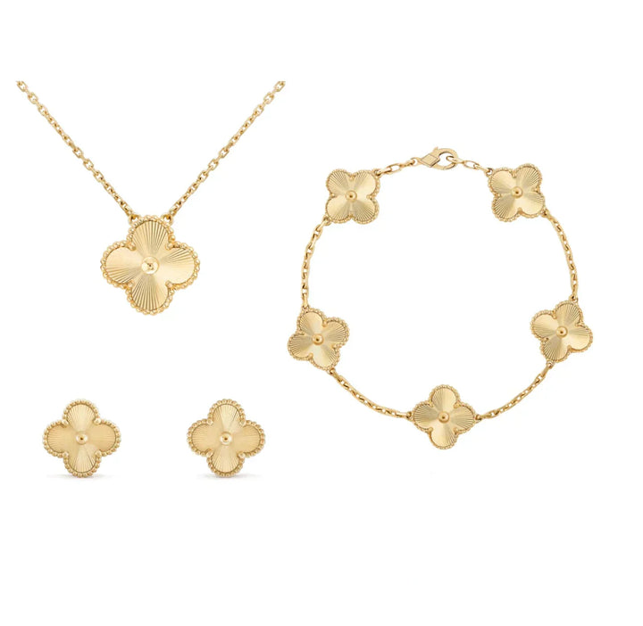 Goldene Schmuckset mit Blumenmotiv: Halskette, Armband, Ohrringe. Eleganter Modeschmuck.