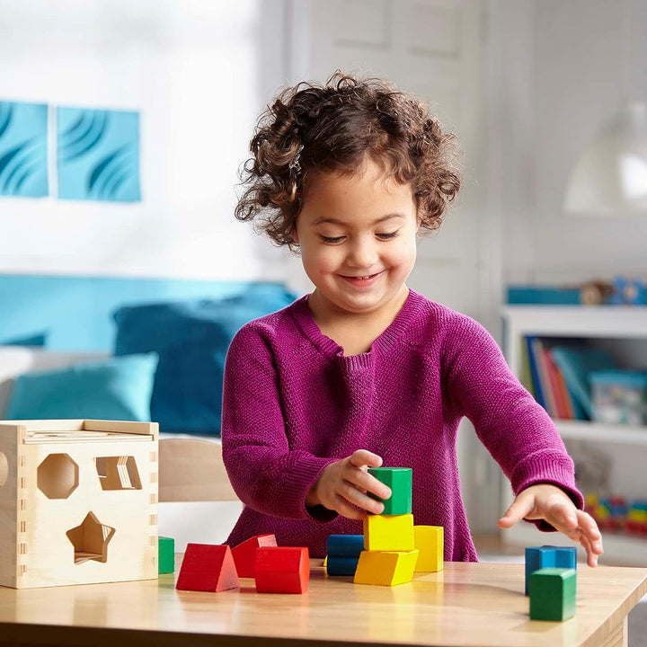 Bunte Montessori Holzspielzeug-Bausteine in verschiedenen Formen wie Dreiecke und Sterne für kreatives Lernen und Spielen.