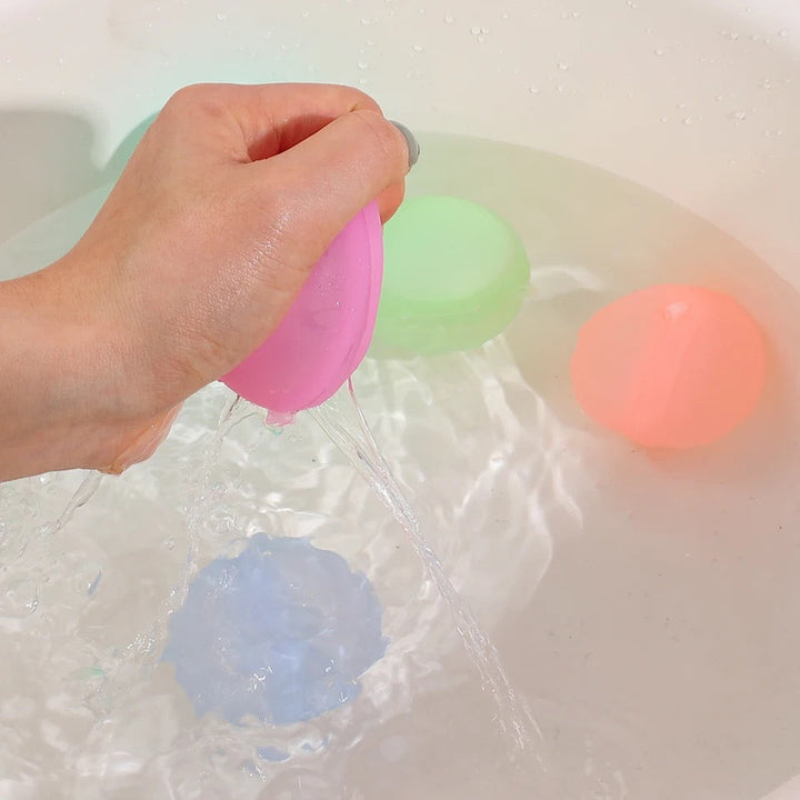 Bunte, wiederverwendbare Wasserbomben, langlebig und umweltfreundlich, ideal für Sommerspaß im Garten und am Strand.