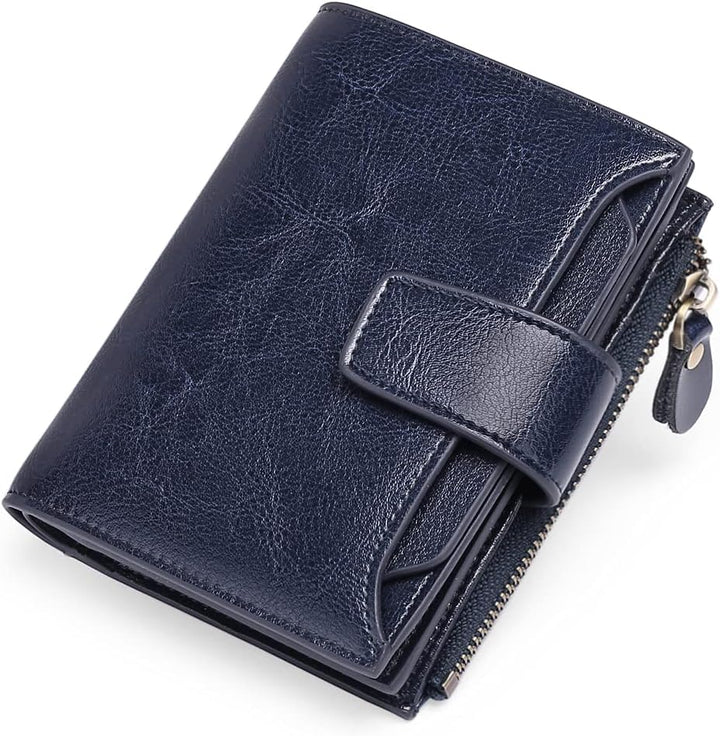Dunkelblaue Leder-Geldbörse mit Reißverschluss und Druckknopf, stilvoll und kompakt.