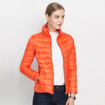 Orange Damen-Daunenjacke, leicht, gesteppt, modisch, ideal für Herbst und Winter.