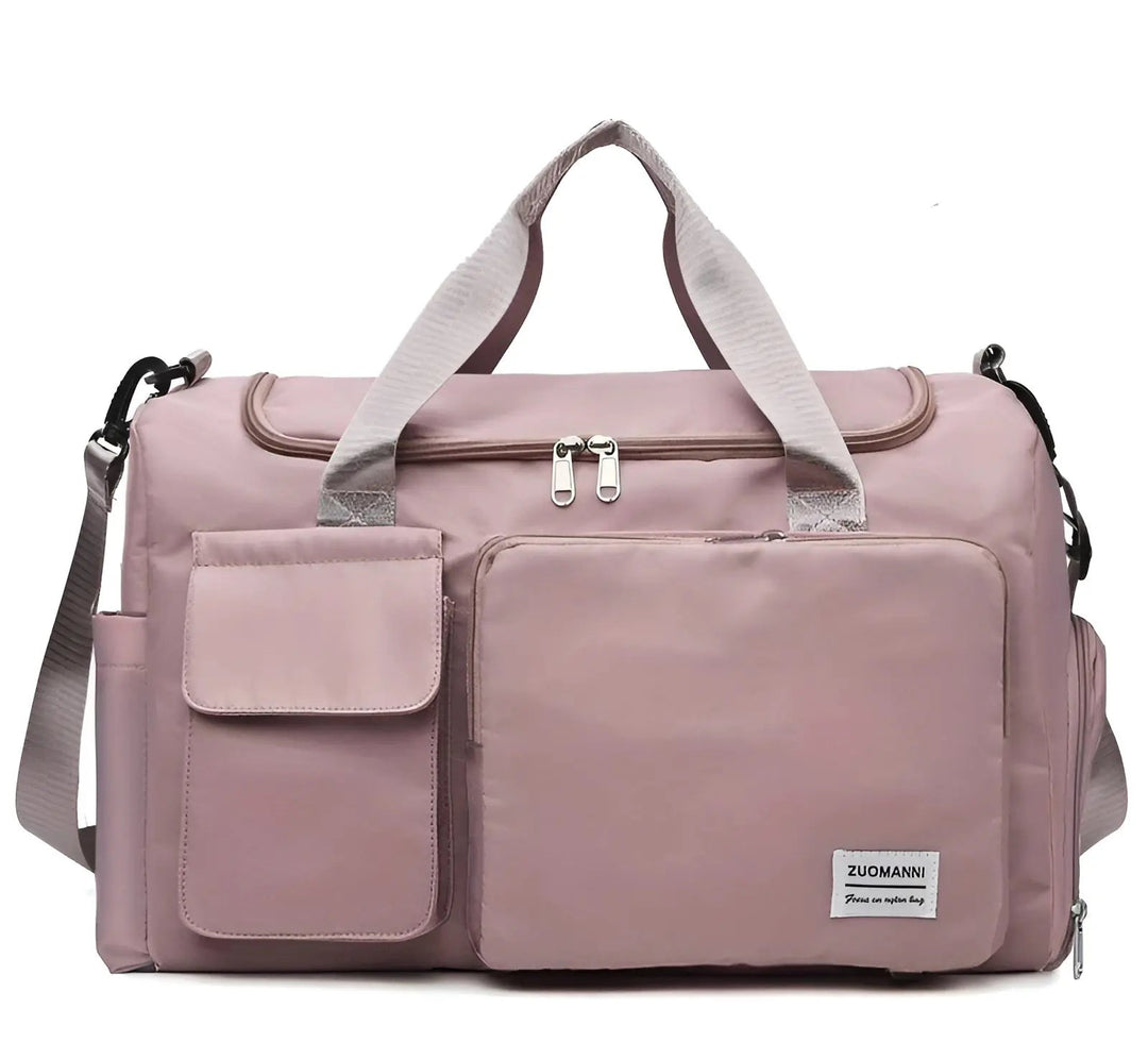 Rosa Reisetasche aus Nylon mit mehreren Fächern und Schultergurt für Damen.