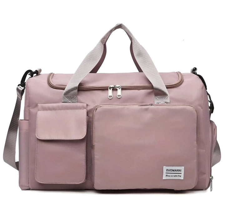 Rosa Reisetasche aus Nylon mit mehreren Fächern und Schultergurt für Damen.
