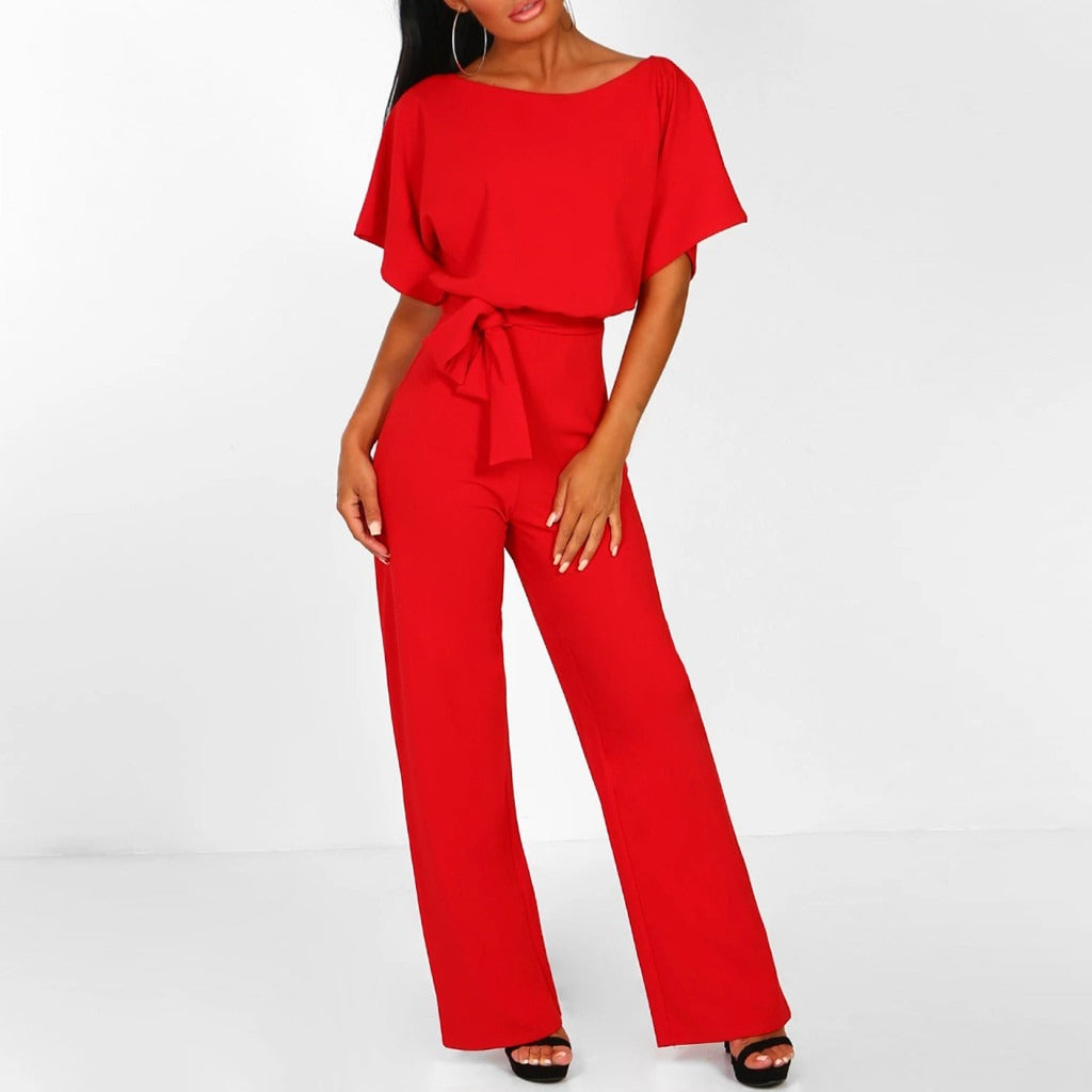 "Dunkelblauer Damen-Jumpsuit mit weiter Silhouette, gebundener Taille und eleganter Optik, passend für Events"