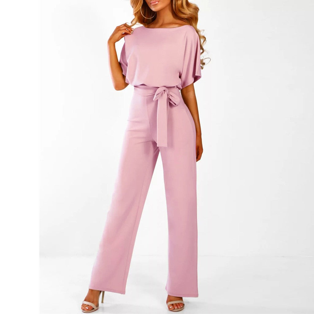 "Dunkelblauer Damen-Jumpsuit mit weiter Silhouette, gebundener Taille und eleganter Optik, passend für Events"