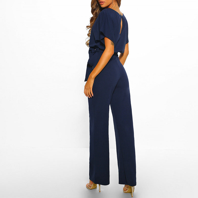 "Dunkelblauer Damen-Jumpsuit mit weiter Silhouette, gebundener Taille und eleganter Optik, passend für Events"