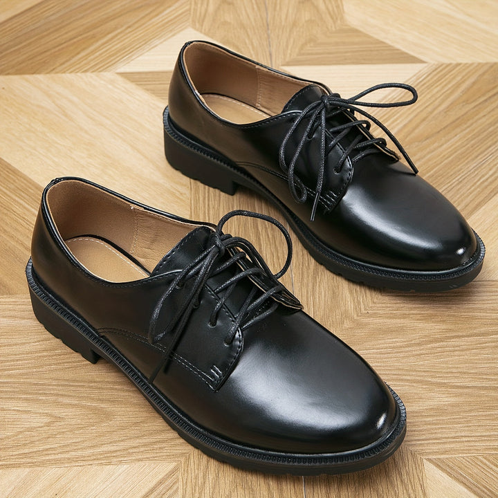"Elegante schwarze orthopädische Damenschnürschuhe, ergonomisches Design, rutschfeste Sohle, vielseitig einsetzbar."