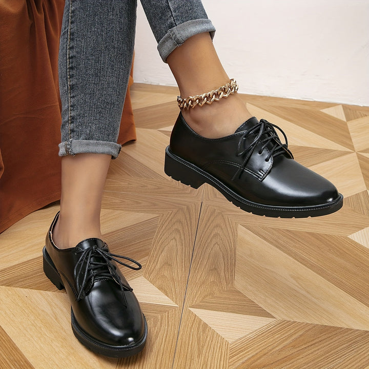 "Elegante schwarze orthopädische Damenschnürschuhe, ergonomisches Design, rutschfeste Sohle, vielseitig einsetzbar."