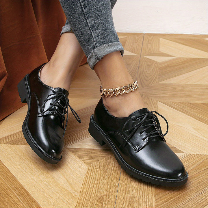 "Elegante schwarze orthopädische Damenschnürschuhe, ergonomisches Design, rutschfeste Sohle, vielseitig einsetzbar."
