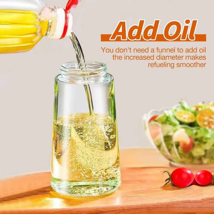 "Eleganter 2-in-1 Olivenölsprüher aus Glas zum Sprühen und Gießen, ideal für präzise Dosierung in der Küche."