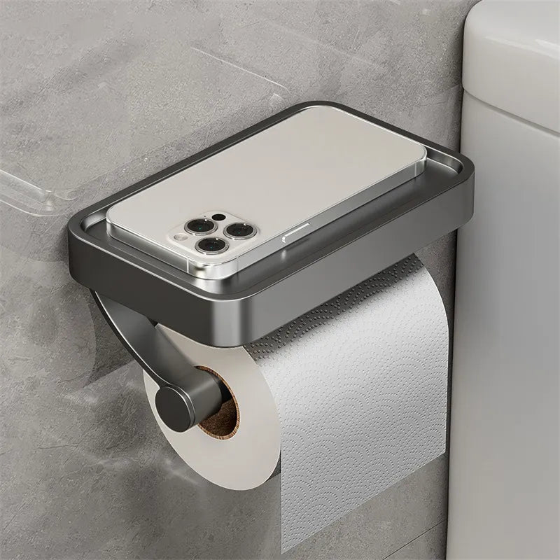 "Eleganter Toilettenpapierhalter mit integrierter Ablage aus gebürstetem Edelstahl, ideal für moderne Badezimmergestaltung."