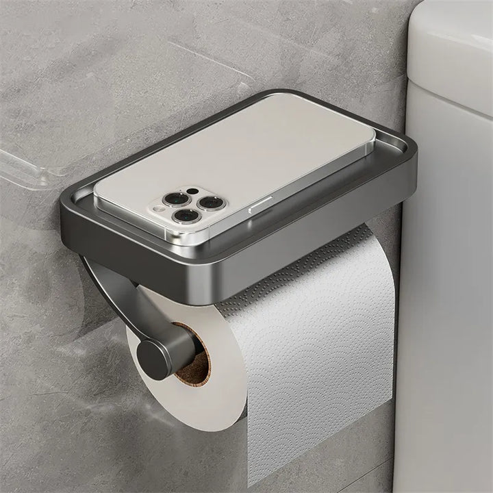 "Eleganter Toilettenpapierhalter mit integrierter Ablage aus gebürstetem Edelstahl, ideal für moderne Badezimmergestaltung."