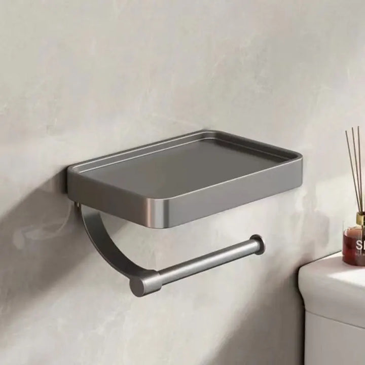 "Eleganter Toilettenpapierhalter mit integrierter Ablage aus gebürstetem Edelstahl, ideal für moderne Badezimmergestaltung."