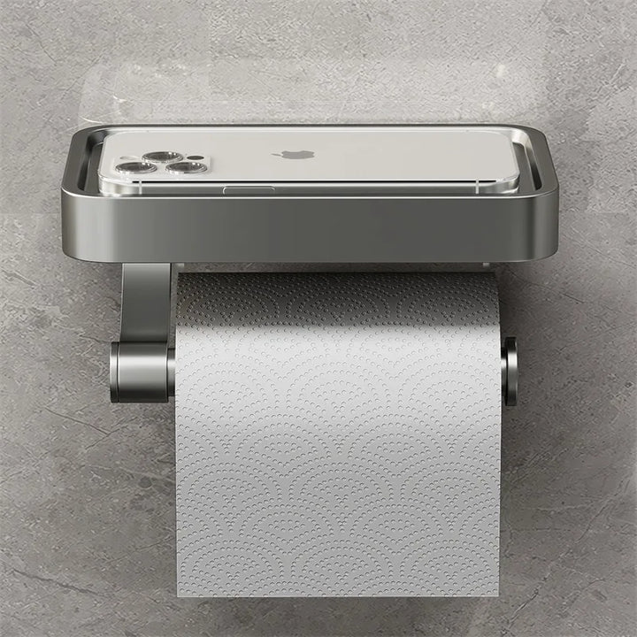 "Eleganter Toilettenpapierhalter mit integrierter Ablage aus gebürstetem Edelstahl, ideal für moderne Badezimmergestaltung."