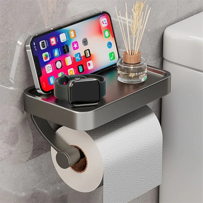 "Eleganter Toilettenpapierhalter mit integrierter Ablage aus gebürstetem Edelstahl, ideal für moderne Badezimmergestaltung."