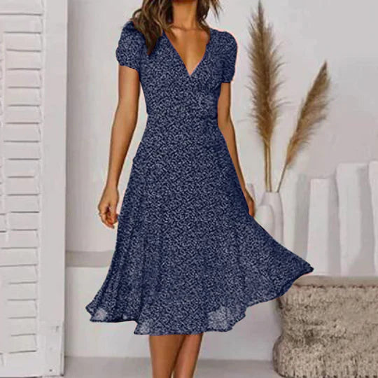 Elegantes A-Linien-Kleid mit V-Ausschnitt, schwingendem Saum, fließendem Stoff in stilvollen Farben für Damen.
