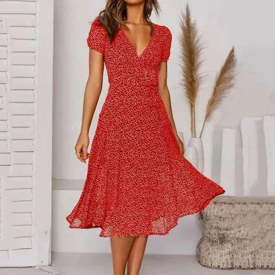 Elegantes A-Linien-Kleid mit V-Ausschnitt, schwingendem Saum, fließendem Stoff in stilvollen Farben für Damen.