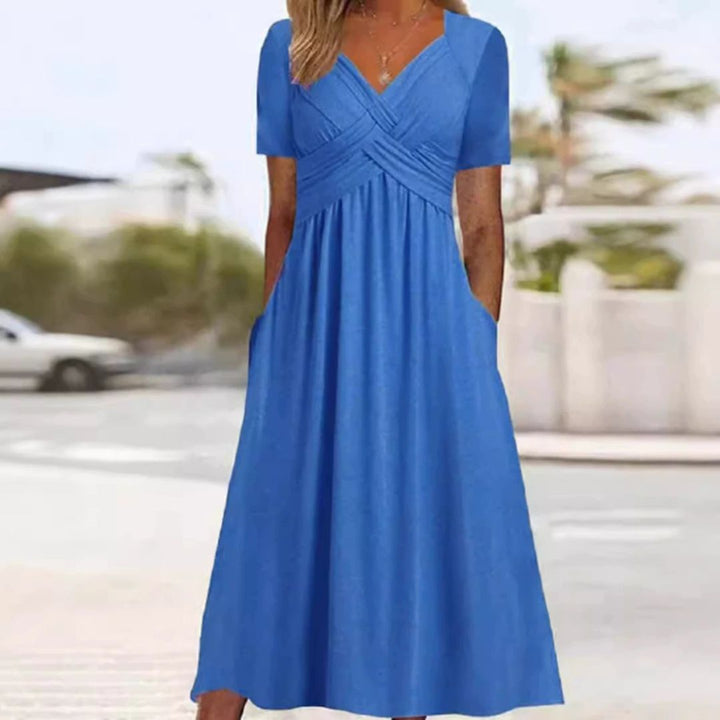 Elegantes Wickelkleid mit kurzen Ärmeln, knielang, ideal für warme Tage, in Grau, Grün, Hellblau und Marineblau.