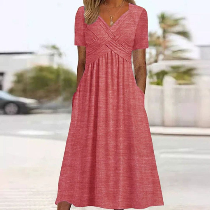 Elegantes Wickelkleid mit kurzen Ärmeln, knielang, ideal für warme Tage, in Grau, Grün, Hellblau und Marineblau.