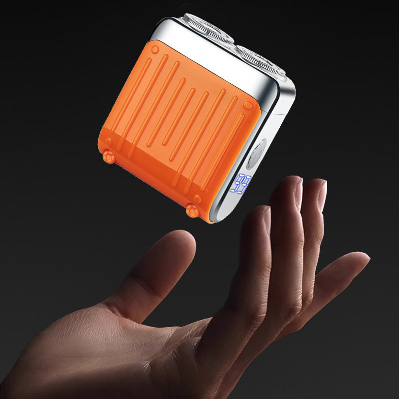 "Elektrorasierer, grau-orange, kompakt, mit LED-Anzeige und magnetischer USB-C-Aufladung für nasse/trockene Rasuren."