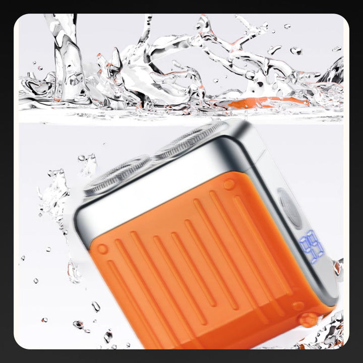 "Elektrorasierer, grau-orange, kompakt, mit LED-Anzeige und magnetischer USB-C-Aufladung für nasse/trockene Rasuren."