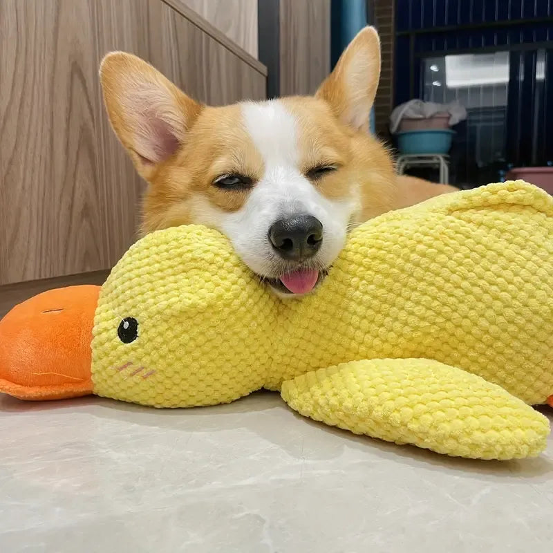 "FlappyDuck Hundespielzeug, gelbe Ente, bietet Zahnpflege und quietschendes Spielvergnügen für Hunde, seitliche Ansicht."