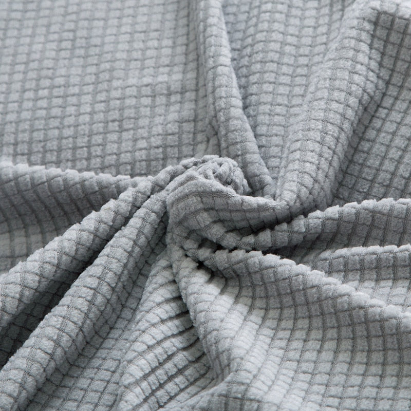 Grauer Waffelstoff, weiche Textur, Baumwolle, ideal für Heimtextilien und Bekleidung.