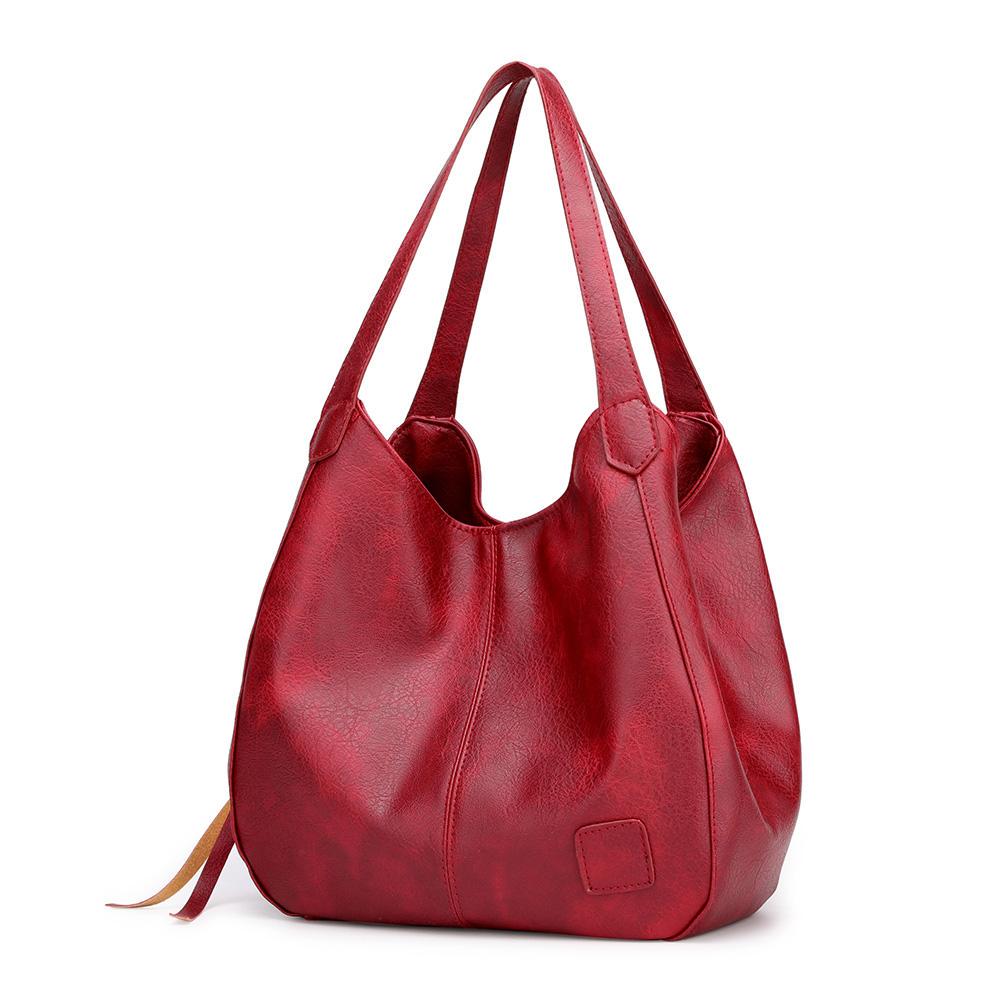"Große stilvolle Ledertasche in Braun, Vintage-Design, ideal für Alltag und Reisen, mit sicheren Reißverschlussdetails."