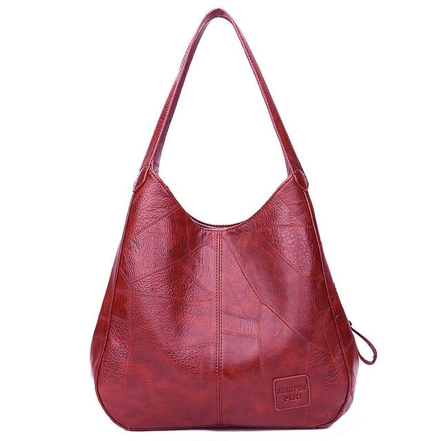 "Große stilvolle Ledertasche in Braun, Vintage-Design, ideal für Alltag und Reisen, mit sicheren Reißverschlussdetails."