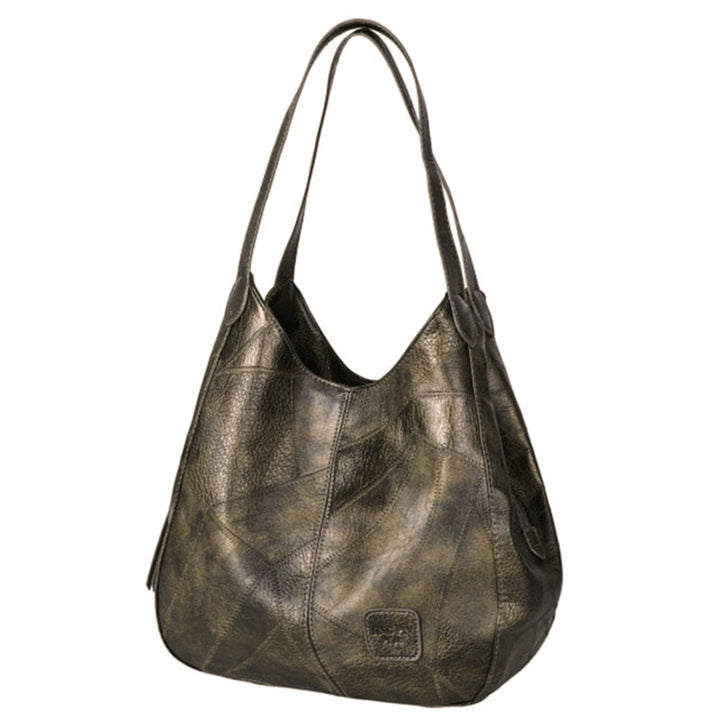 "Große stilvolle Ledertasche in Braun, Vintage-Design, ideal für Alltag und Reisen, mit sicheren Reißverschlussdetails."