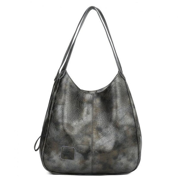 "Große stilvolle Ledertasche in Braun, Vintage-Design, ideal für Alltag und Reisen, mit sicheren Reißverschlussdetails."