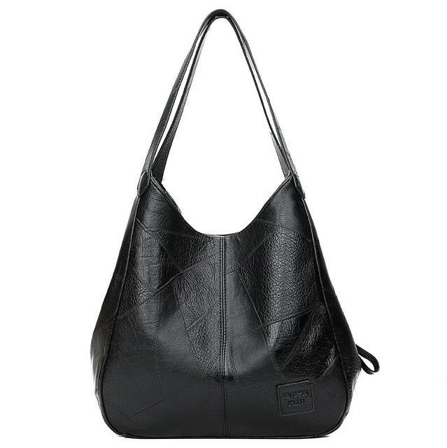 "Große stilvolle Ledertasche in Braun, Vintage-Design, ideal für Alltag und Reisen, mit sicheren Reißverschlussdetails."
