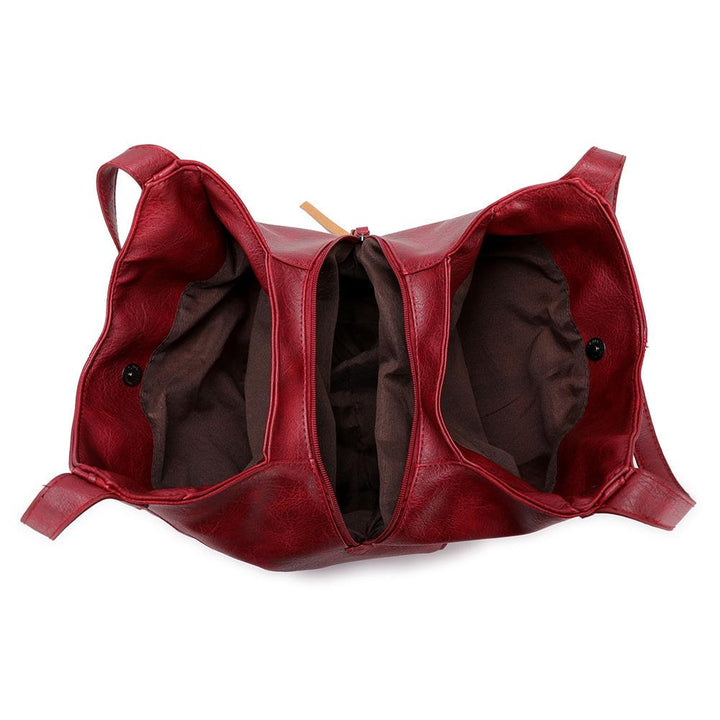 "Große stilvolle Ledertasche in Braun, Vintage-Design, ideal für Alltag und Reisen, mit sicheren Reißverschlussdetails."