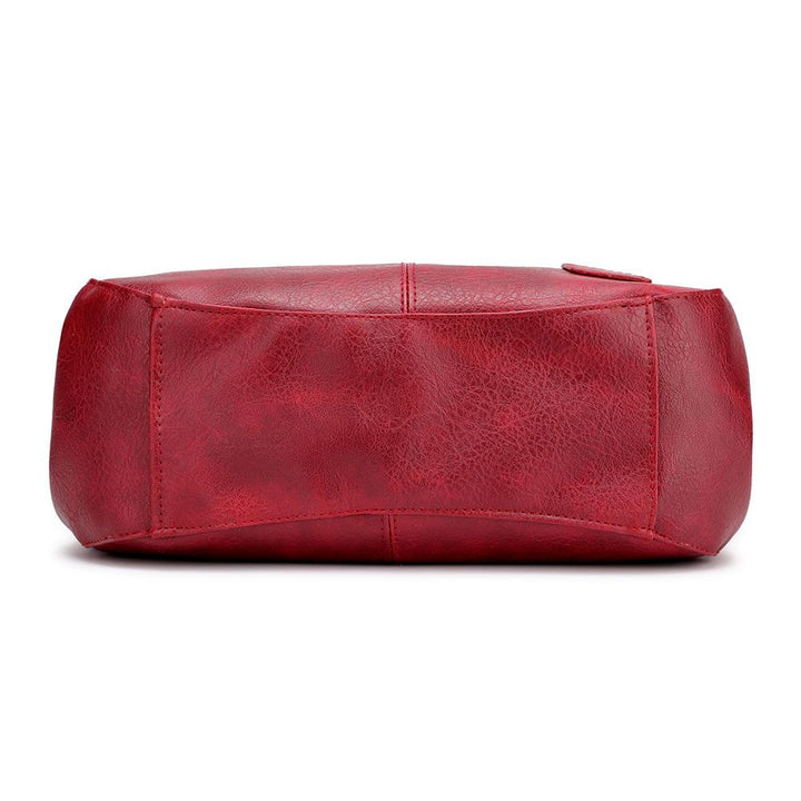 "Große stilvolle Ledertasche in Braun, Vintage-Design, ideal für Alltag und Reisen, mit sicheren Reißverschlussdetails."