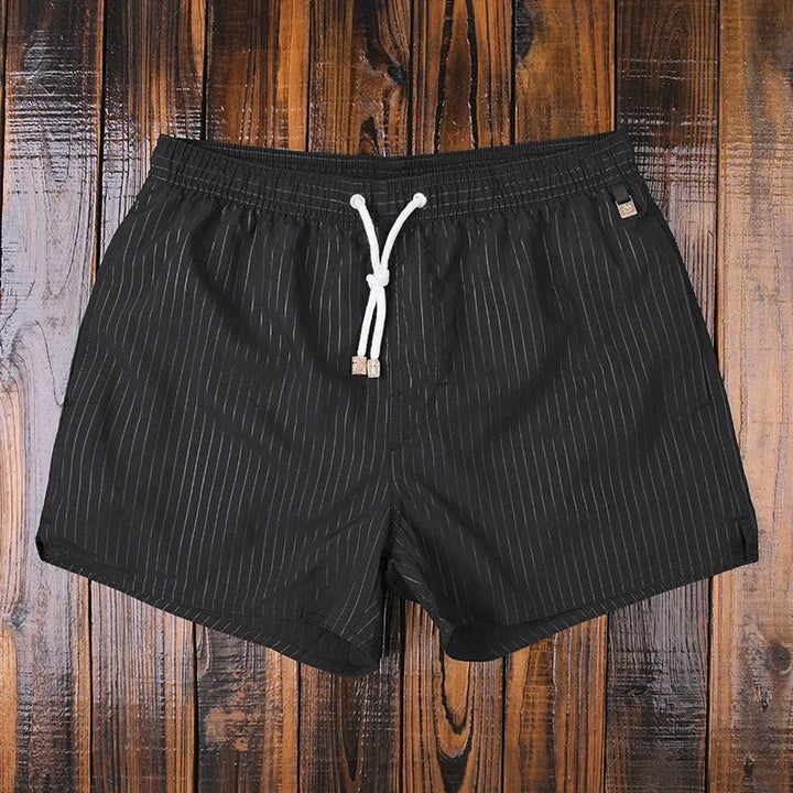 "Herren Badeshorts mit Streifenmuster, elastischer Bund, blau-weiß, ideal für Strand und Pool"