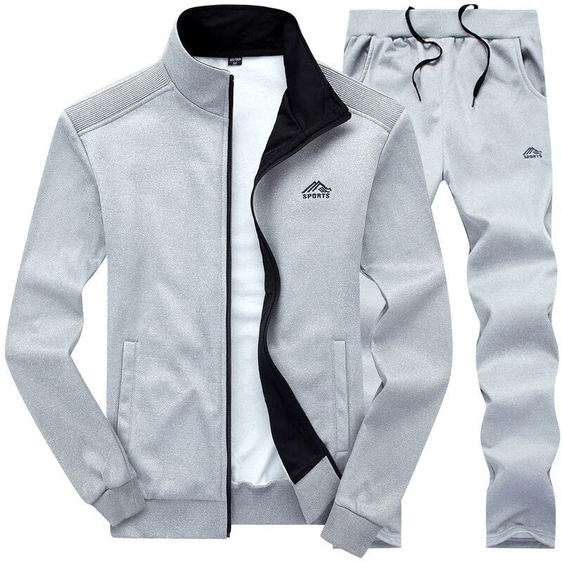 Herren Jogging Set in Grau, funktional & robust, mit Wind- & Wasserschutz, ideal für Outdoor-Training, Jacke & Hose.