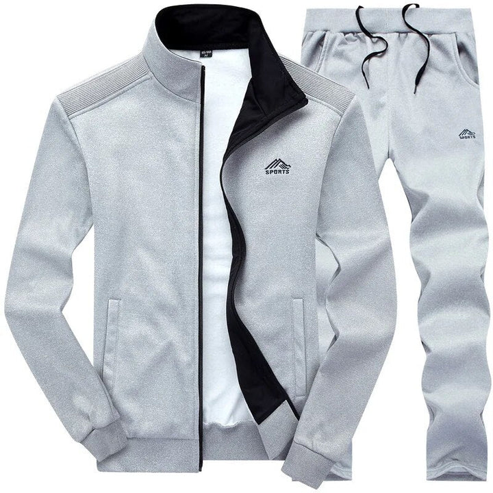 Herren Jogging Set in Grau, funktional & robust, mit Wind- & Wasserschutz, ideal für Outdoor-Training, Jacke & Hose.