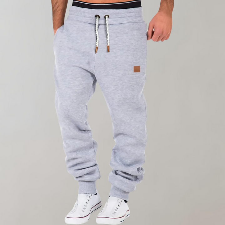 "Herren Jogginghose, modern und bequem, dunkelgrau, schmaler Schnitt, elastischer Bund, Taschen, ideal für Sport und Freizeit
