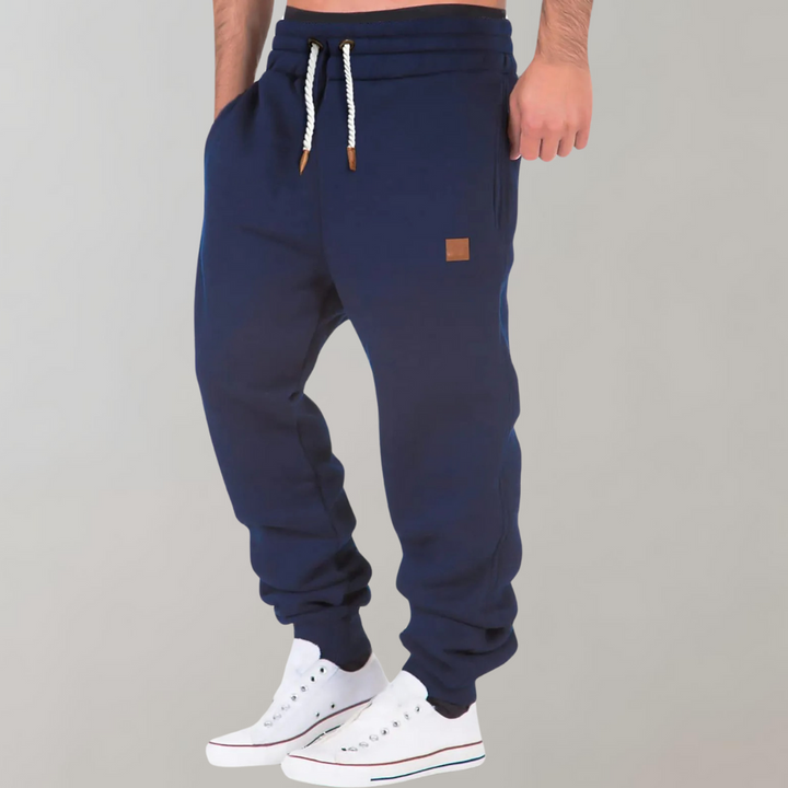 "Herren Jogginghose, modern und bequem, dunkelgrau, schmaler Schnitt, elastischer Bund, Taschen, ideal für Sport und Freizeit
