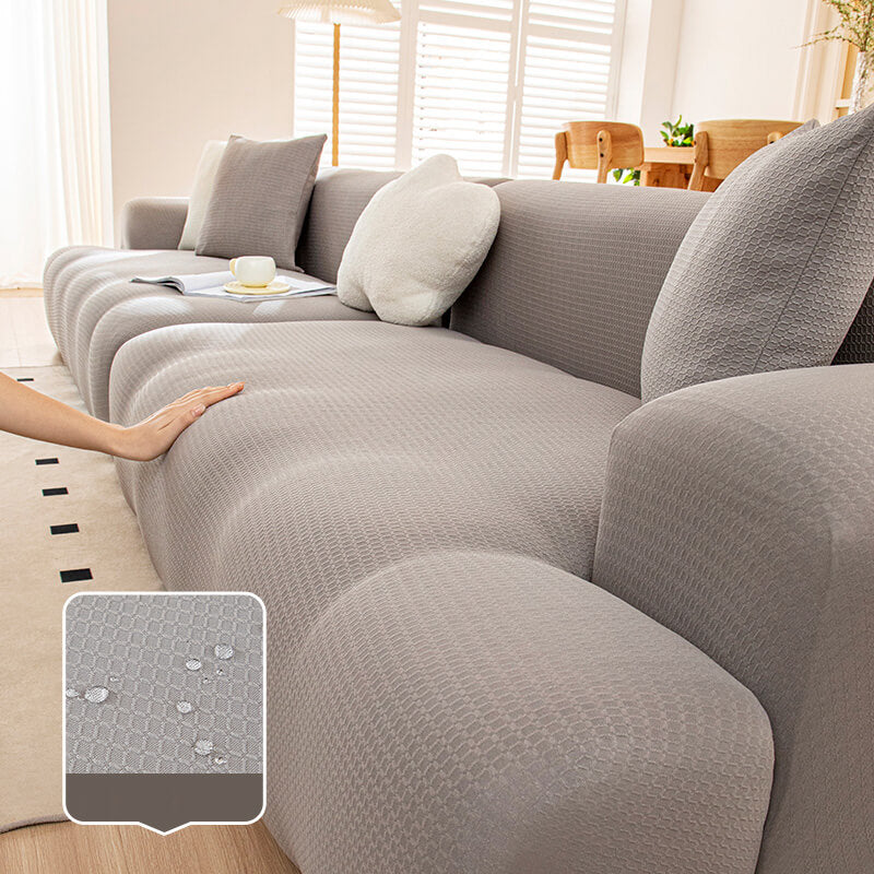 "Hochelastischer wasserdichter Sofabezug in Beige, schützt Möbel vor Kratzern, Flüssigkeiten, ideal für Haustierbesitzer."