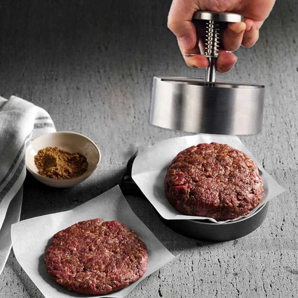 Hochwertige Burgerpresse aus Edelstahl, ergonomisch, für perfekt geformte Patties; spülmaschinengeeignet, langlebig.