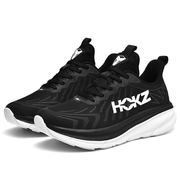 Schwarze HOKZ Trainingsschuhe, atmungsaktiv, mit weißer Sohle, ideal für Sport und Fitness.