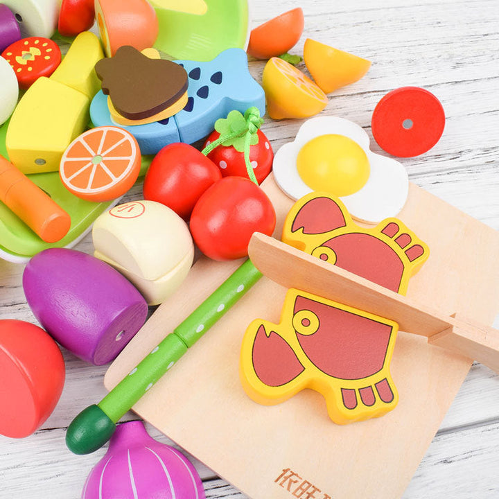 "Holz Montessori Schneide Spielset mit buntem Holz-Obst und -Gemüse, geeignet für kreatives Lernen und kleine Kinderhände."