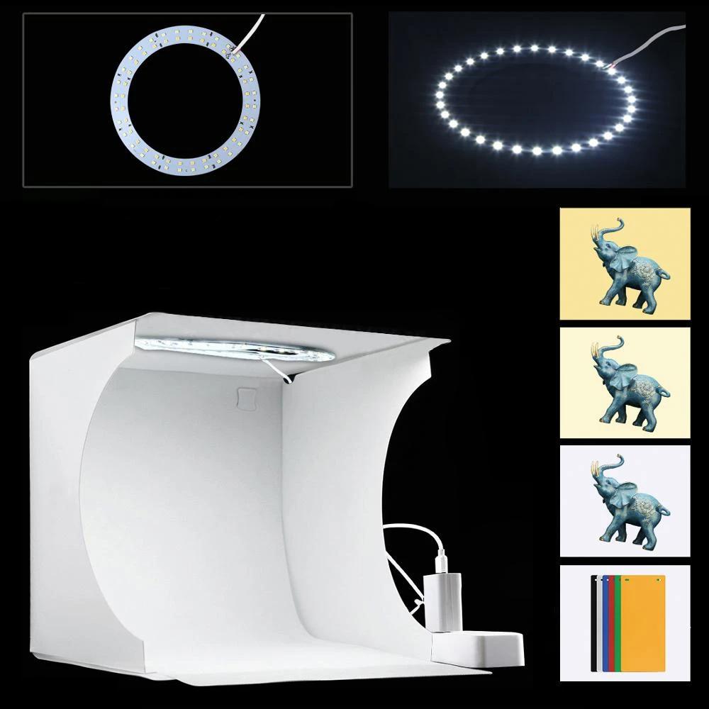 "Kompaktes tragbares Fotostudio mit LED-Licht: Weiße Box, darin hell beleuchtet, ideal für Produktfotografie Gadgets."