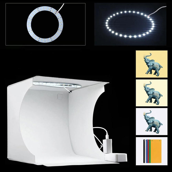"Kompaktes tragbares Fotostudio mit LED-Licht: Weiße Box, darin hell beleuchtet, ideal für Produktfotografie Gadgets."